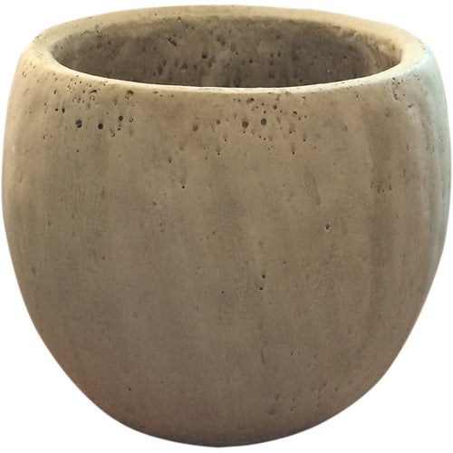 An earthy, organic, concrete vessel to be filled with flowers in the color palette of your choice.