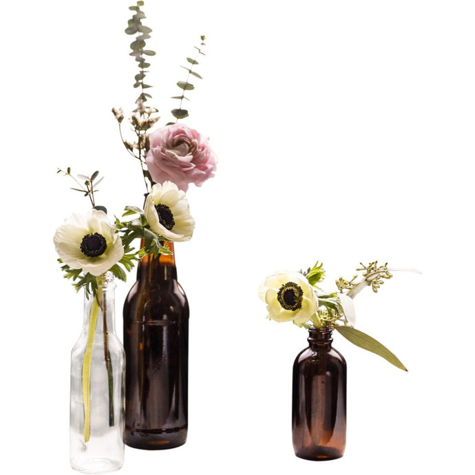 Vintage, rustic, modern style glass bottles of flowers for weddings